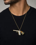 Male model wearing 10k Gold Gun Pendant