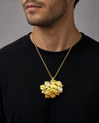Male model wearing Vintage 18k Gold Estate Textured Leaf Pendant