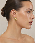 Female model wearing Vintage14k Gold Estate Knot Earrings