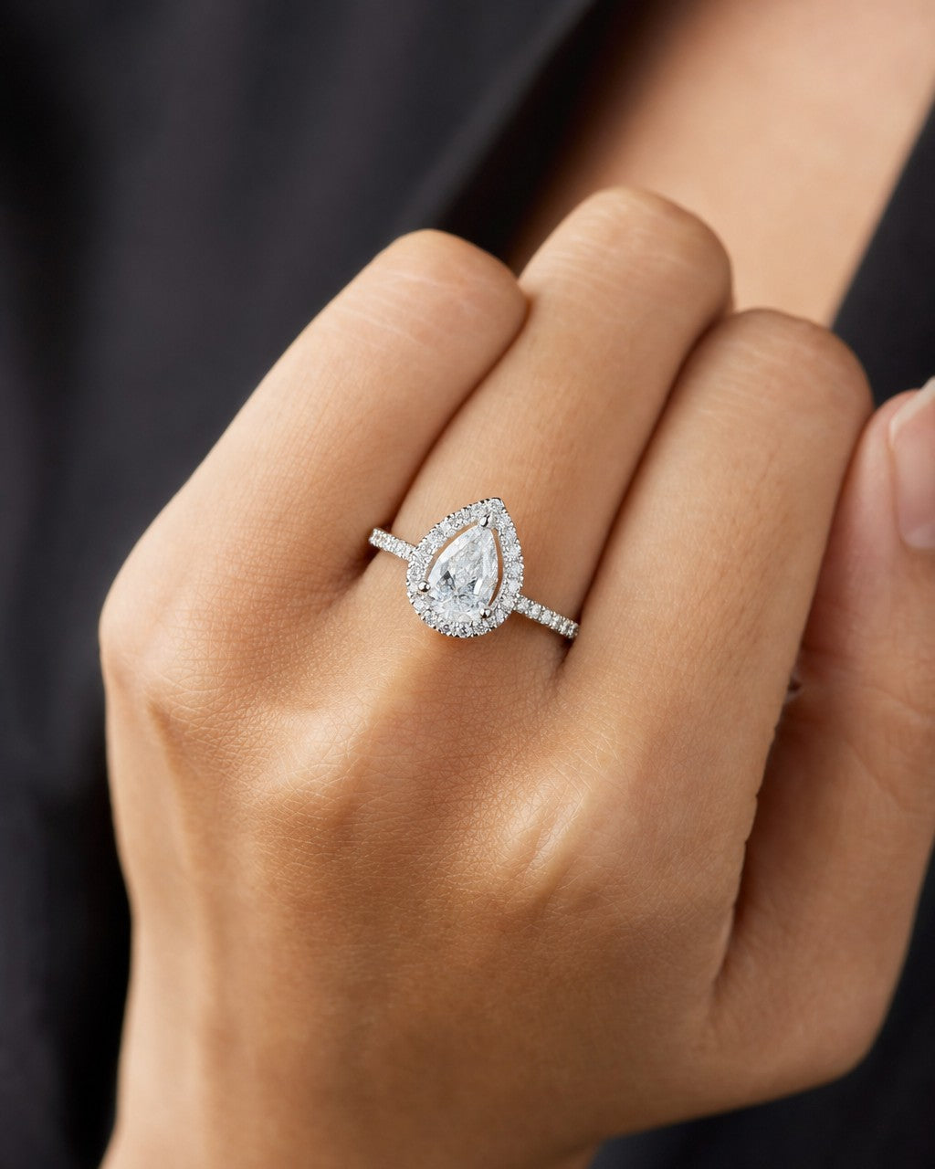 Female model wearing 14k Pear Cut Halo Lab Diamond Engagement Ring