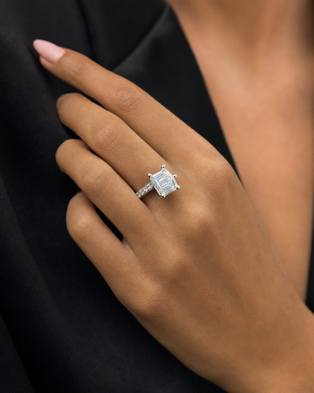 Female model wearing 14k Elegant Emerald Cut Lab Diamond Engagement Ring