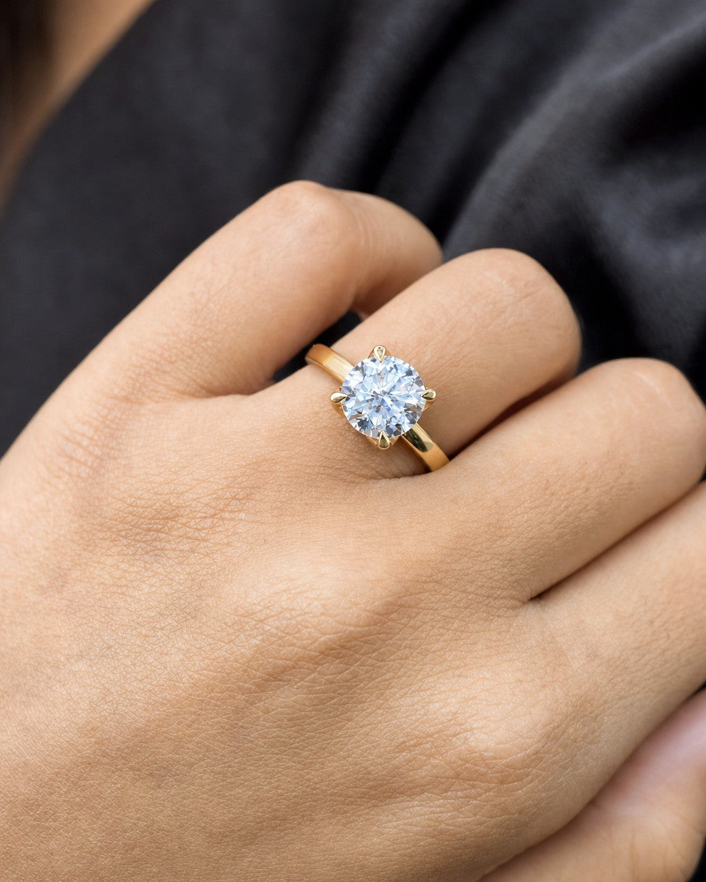 Female model wearing 14k Circle Stone Lab Diamond Engagement Ring