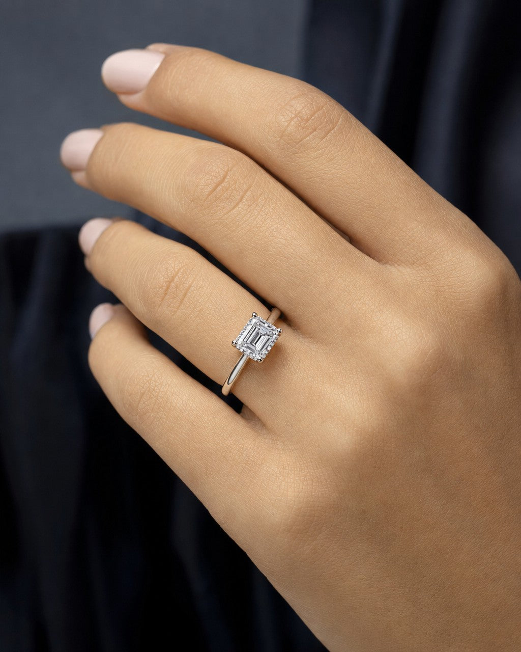 Female model wearing 14k Emerald Cut Lab Diamond Engagement RIng