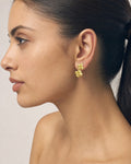 Female model wearing 18K Gold Clover earring