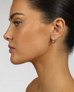 Female model wearing 14k Gold and Pink center stone earrings