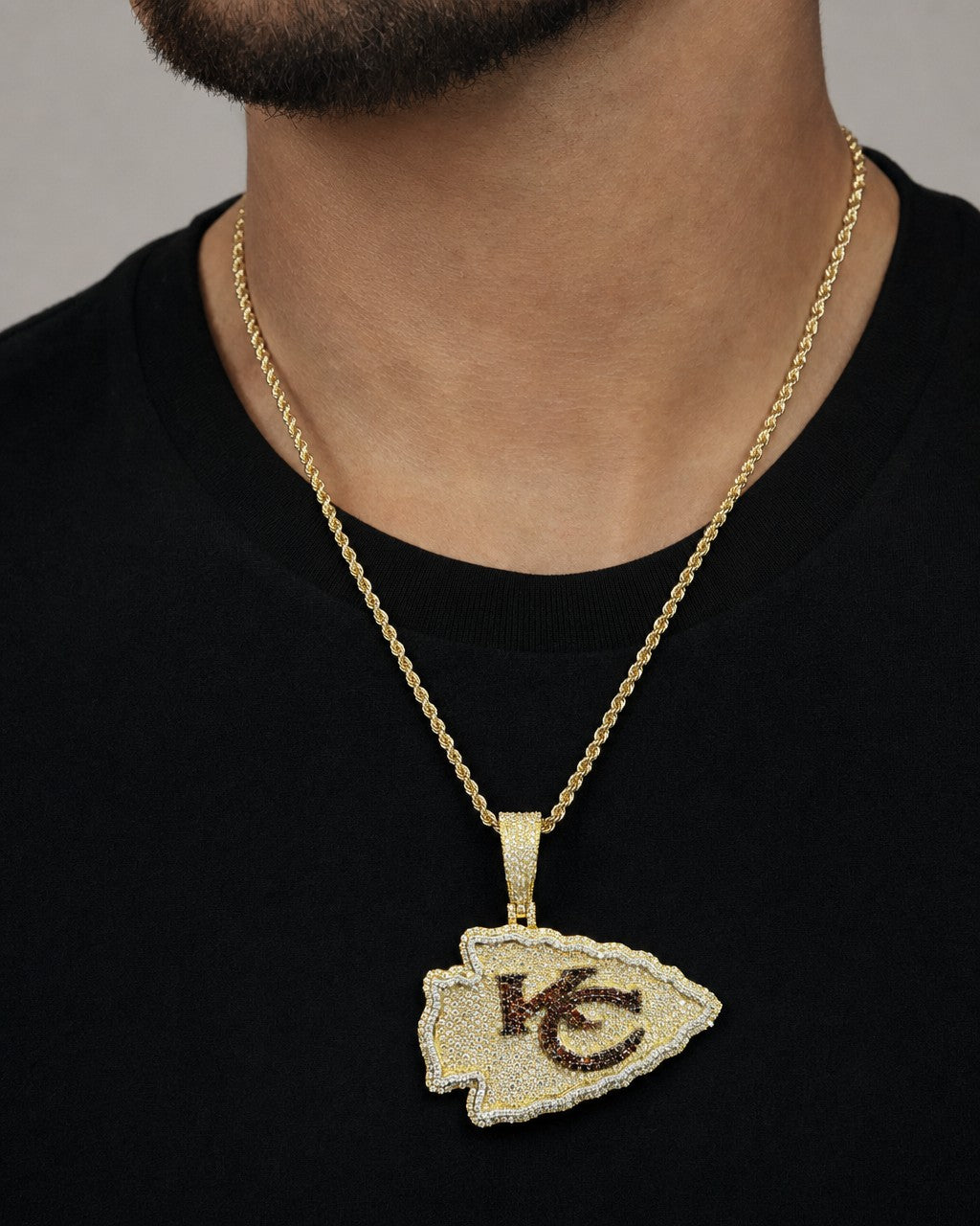 Male model wearing 10K Kansas City Chief Custom Pendant