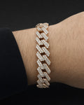 Male model wearing 10K Gold & Diamond Cuban Link Bracelet 12mm