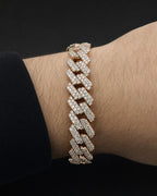 Male model wearing 10K Gold & Diamond Cuban Link Bracelet 12mm