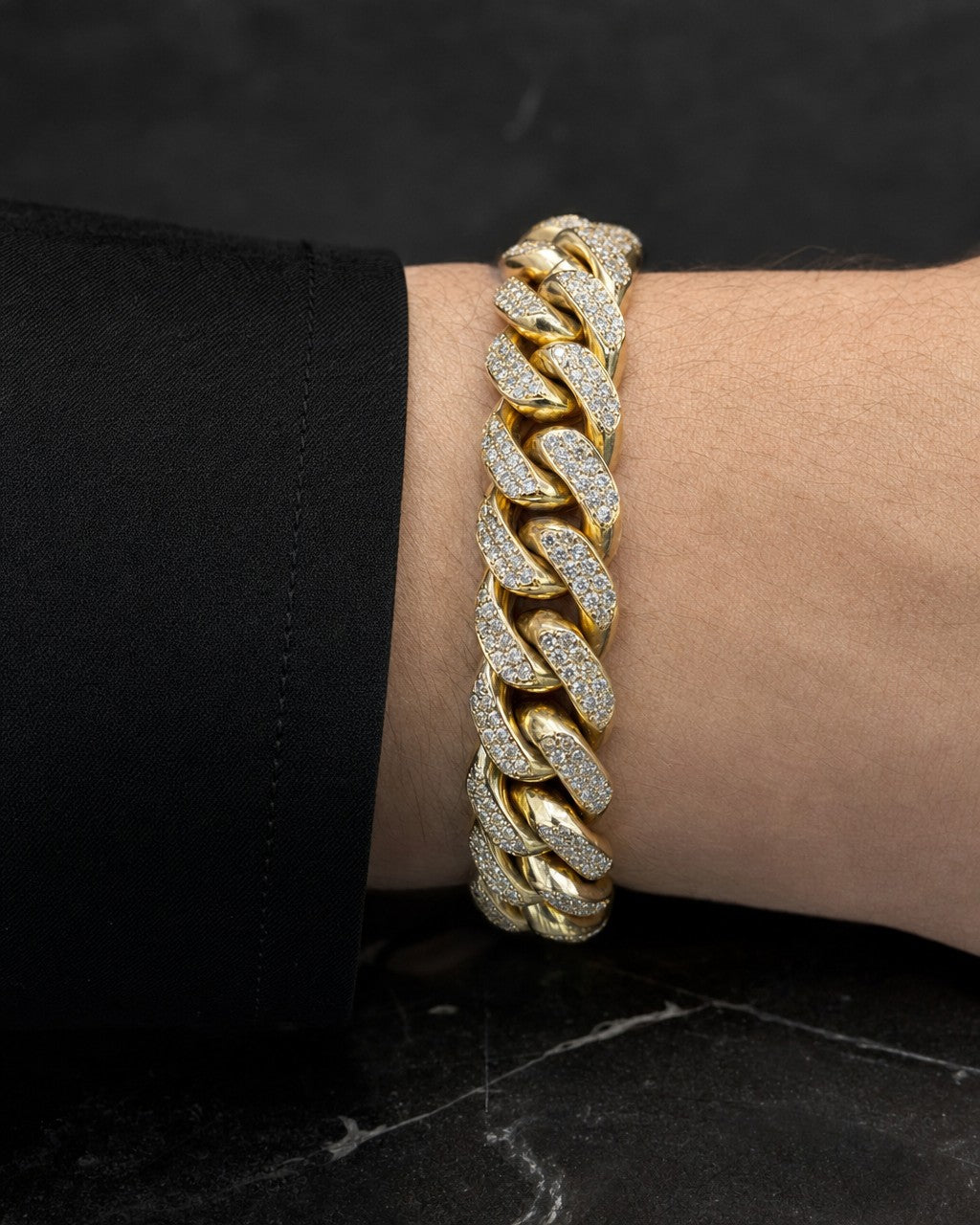 Male model wearing 14K Gold & Diamond cuban link bracelet 12mm