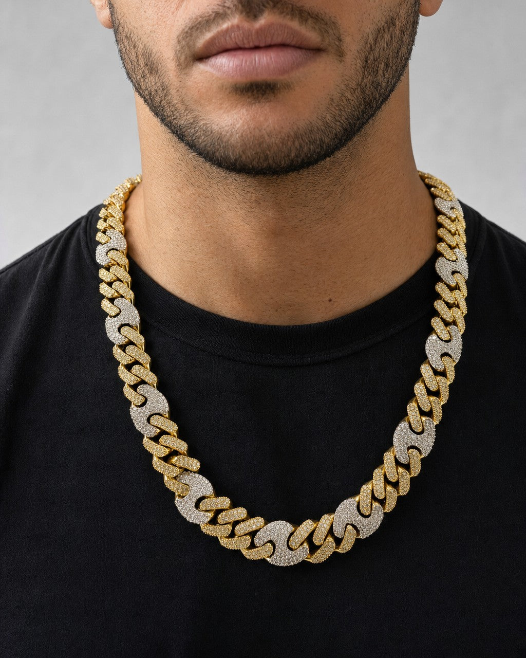 Male model wearing 10K two-tone gold & diamonds cuban link 15.5mm