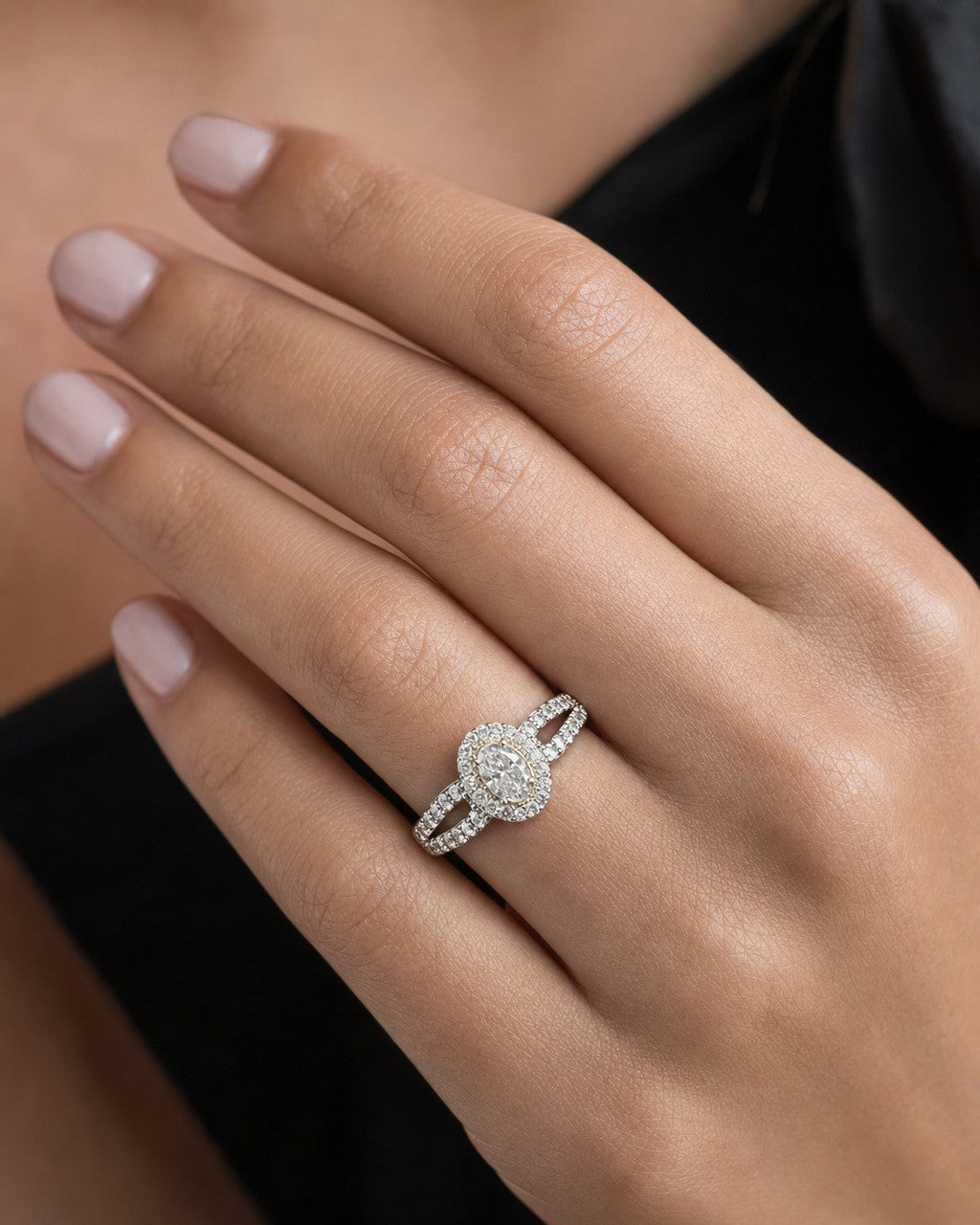 Female model wearing 14k Oval Diamond Engagement Ring