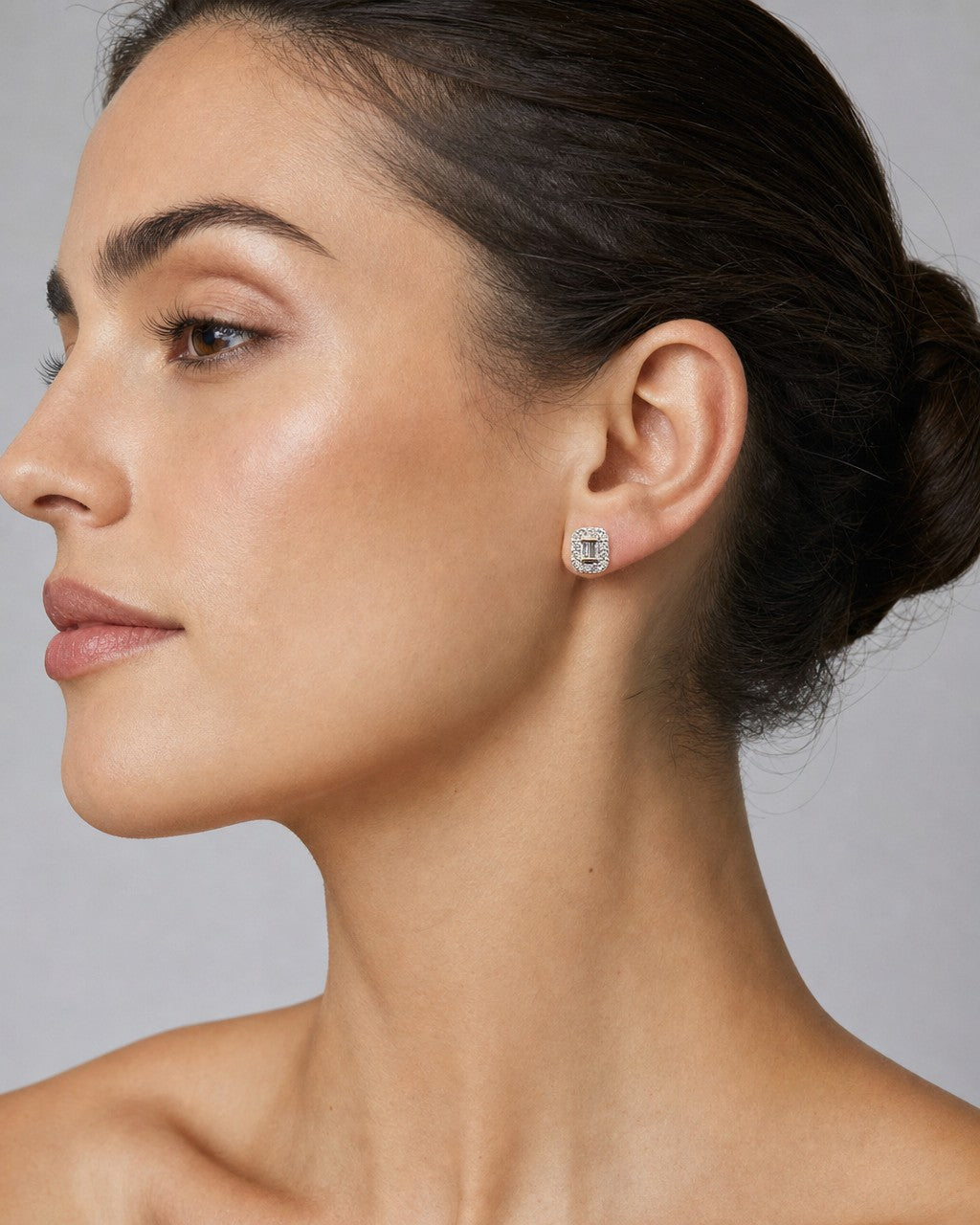 Female model wearing 10k Baguette Center Rectangle Diamond Earrings