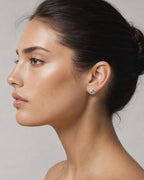 Female model wearing 10k Baguette Halo Diamond Earrings