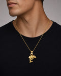 Male model wearing 18k Double-Sided Dolphin Pendant
