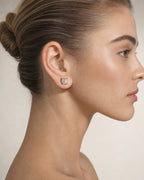 Female model wearing 10K Square Coordinate Earrings