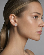 Female model wearing 10K Thick Round Earrings