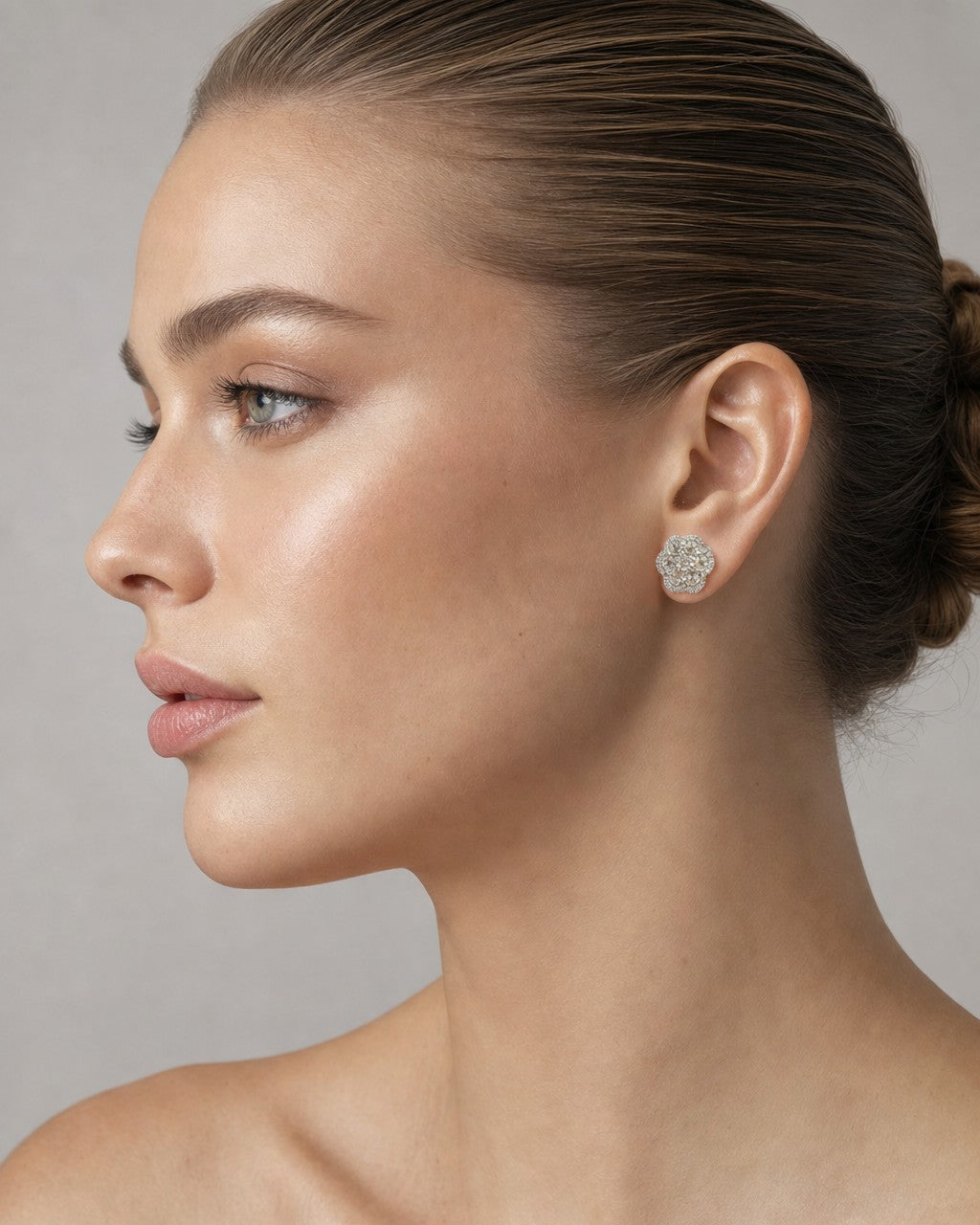Female model wearing 14K Jumbo Halo Diamond Flower Earrings