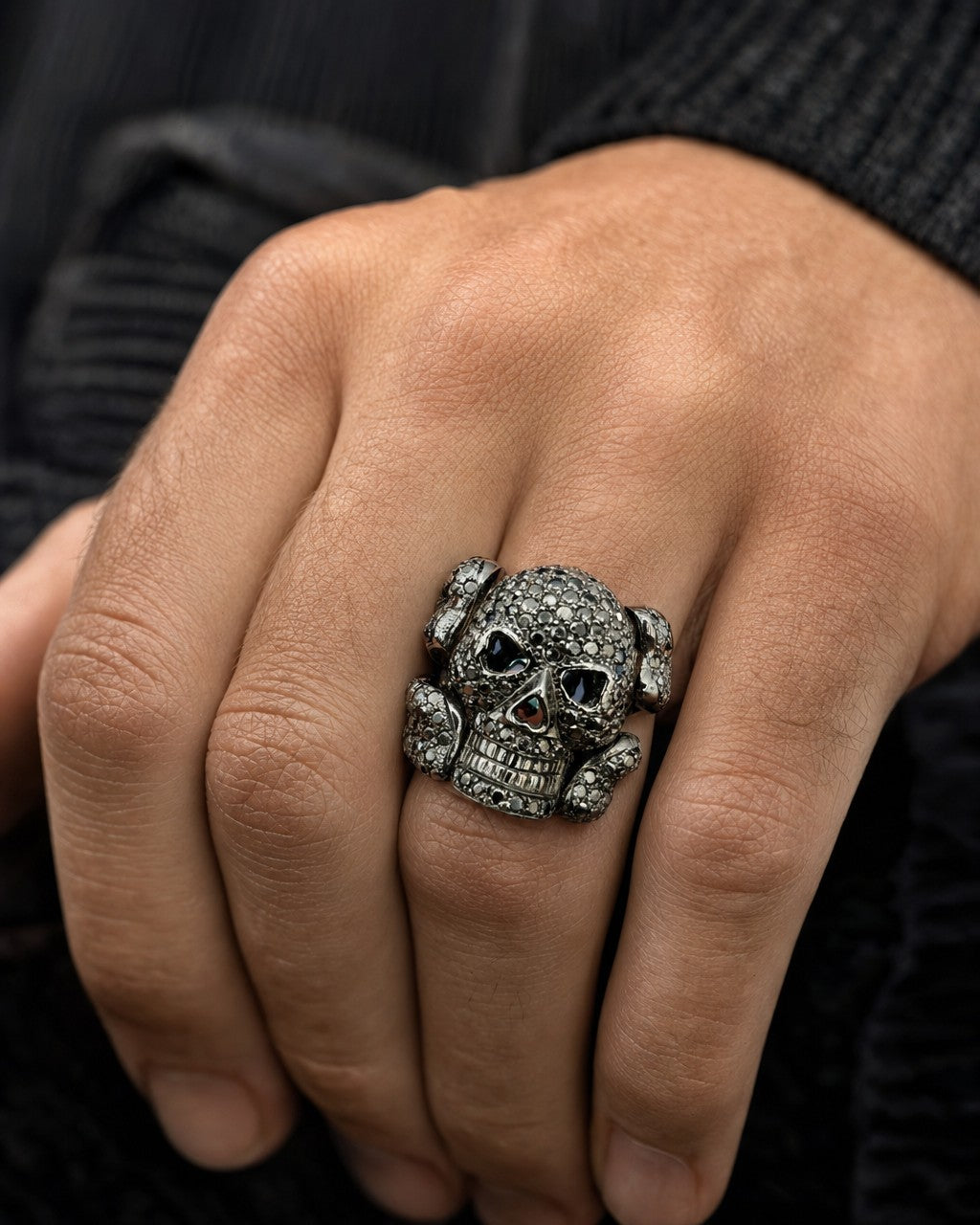 Male model wearing 14K Black Diamond Skull and Bones Ring