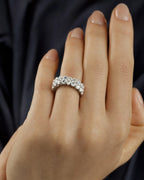 Female model wearing Platinum Eternity Band with Oval Diamonds