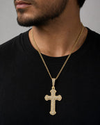 Male model wearing 10K Trefoil Cross Diamond Pendant