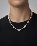 Male model wearing 14k Barbed Wire Stations Necklace