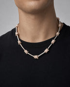 Male model wearing 14k Barbed Wire Stations Necklace