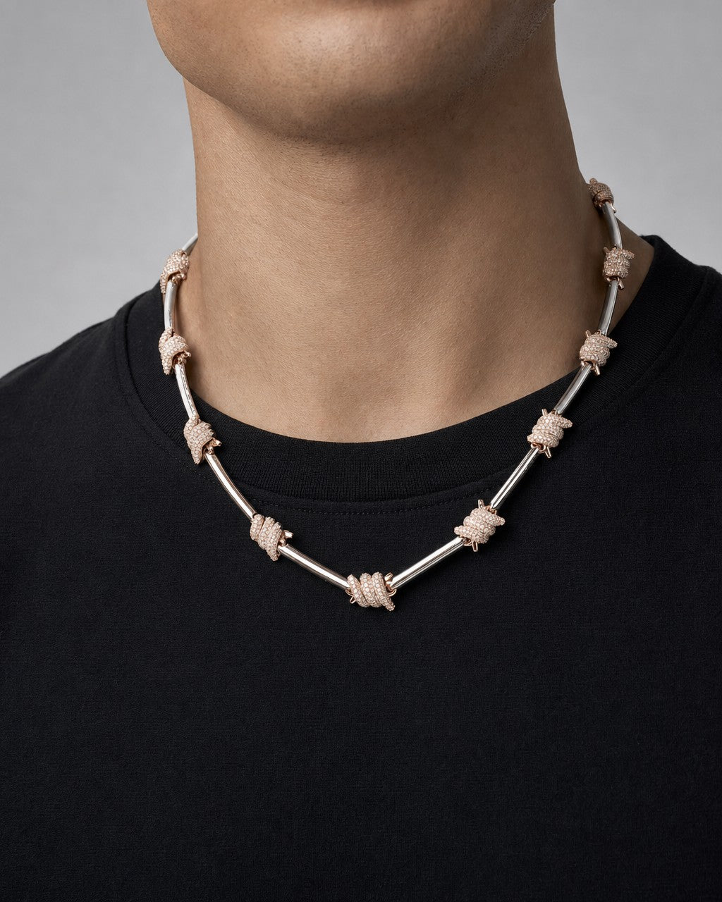 Male model wearing 14k Barbed Wire Stations Necklace