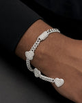 Male model wearing 10K 7 Inches Baguette Heart Cuban Bracelet