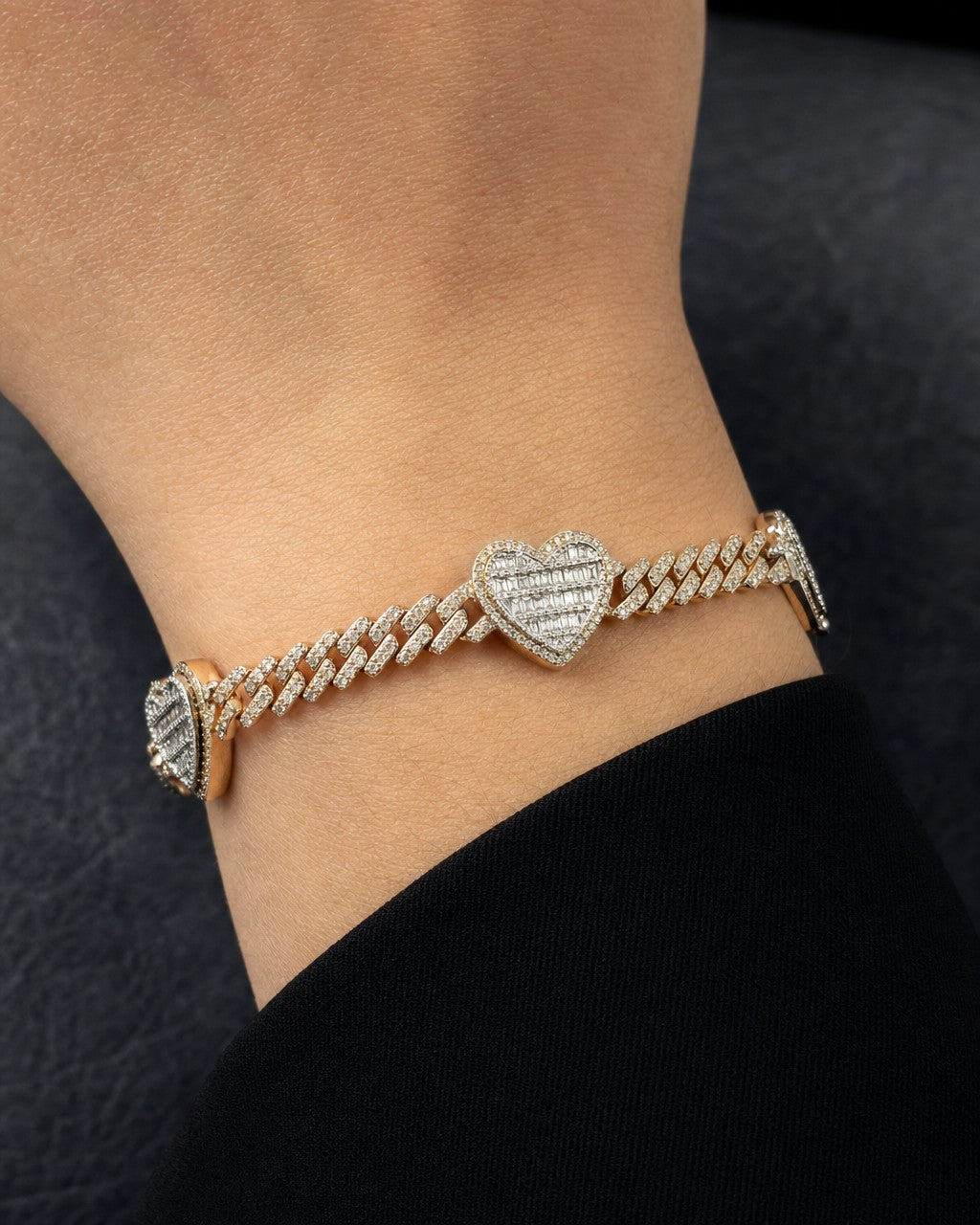 Male model wearing 10K Baguette Heart Cuban Bracelet