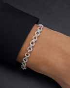 Male model wearing 10K Infinity Colored Stones Diamond Bracelet