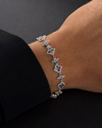 Male model wearing 10k Cross and Clover Rainbow Bracelet