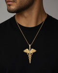 Male model wearing 14K Caduceus Pendant