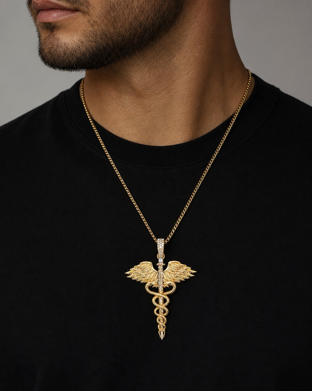 Male model wearing 14K Caduceus Pendant