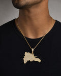 Male model wearing 14k Dominican Republic Pendant