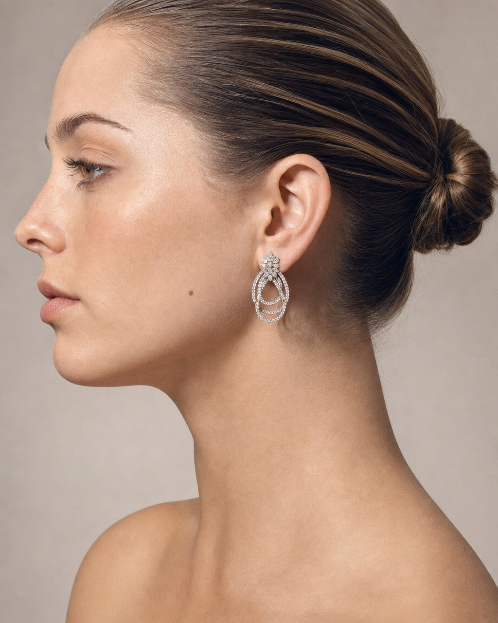 Female model wearing 14K Interlaced Hanging Earrings