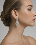 Female model wearing 14k Baguette Pear Drops Hanging Earrings