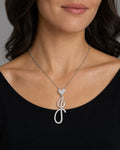 Female model wearing 14K Initial J Script Heart Diamond Pendant