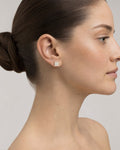 Female model wearing 10K Square Dance Floor Diamond Earrings
