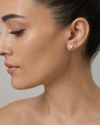 Female model wearing 10K Festive Heart Earrings