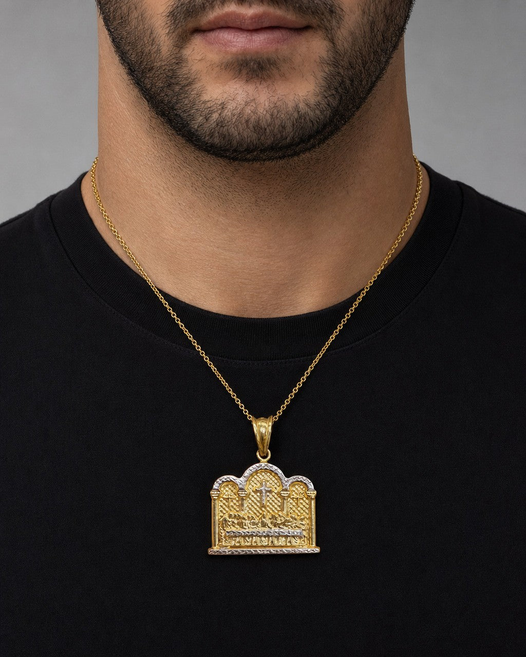Male model wearing 14k Gold Last Supper pendant