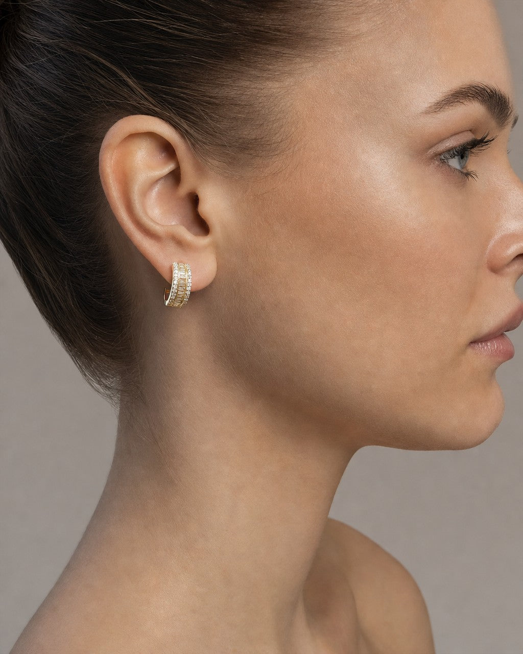 Female model wearing 14k Baguette Small Hoop Earrings