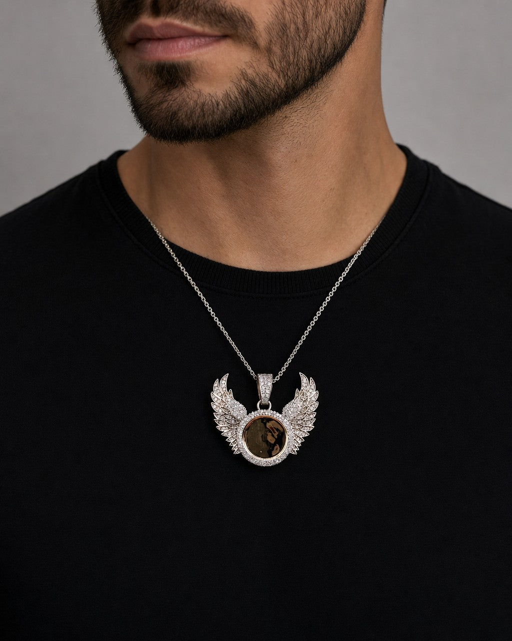 Male model wearing 10k Raised Wing Photo Pendant