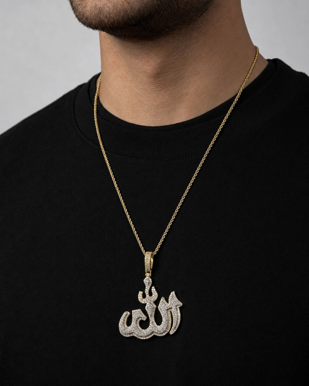 Male model wearing 10K 3D Allah Diamond Pendant