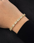 Male model wearing 14k Baguette Bridge Bracelet