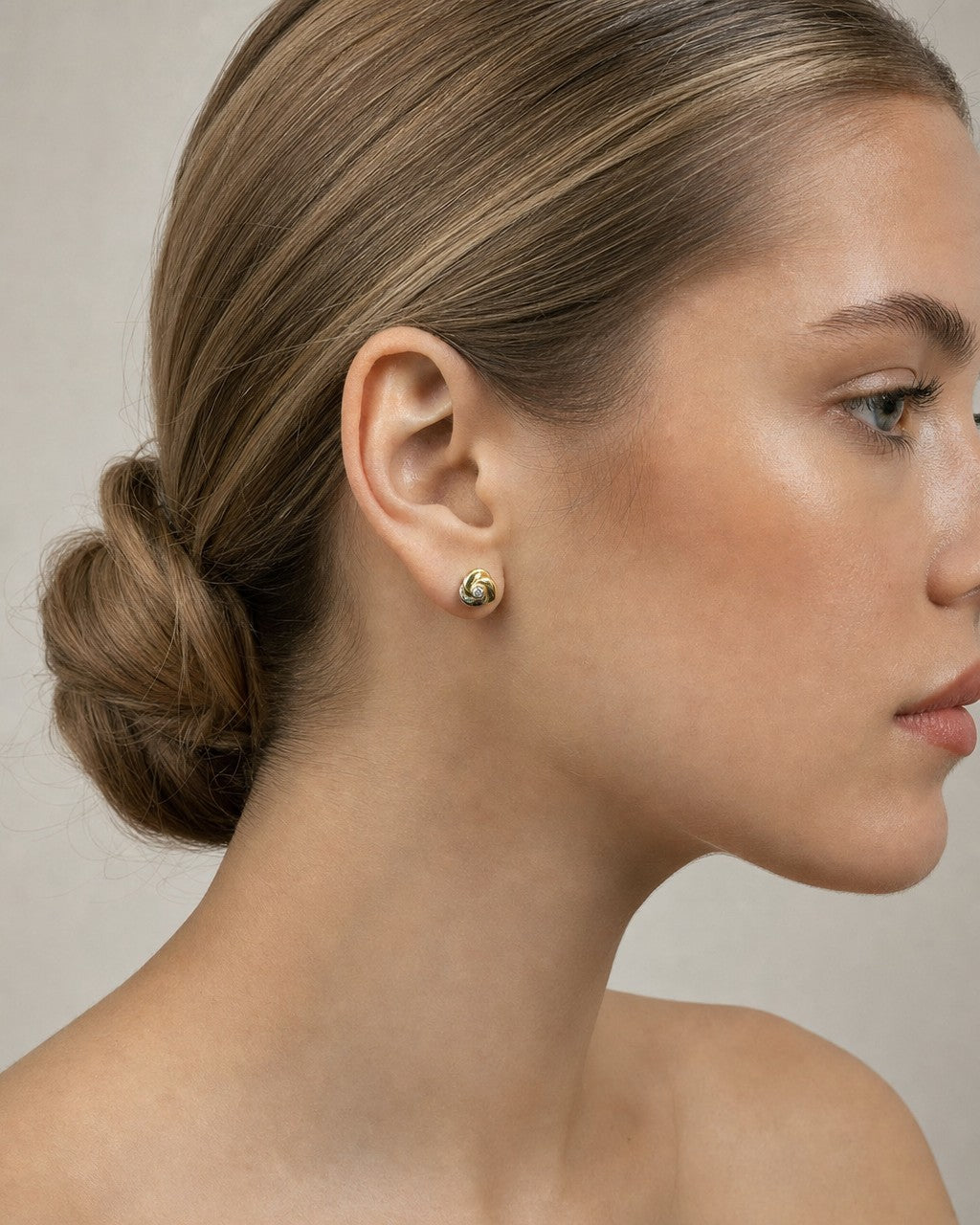 Female model wearing 18k Diamond Cartier Earrings