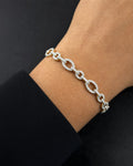 Male model wearing 14k Oval Link Diamond Bracelet