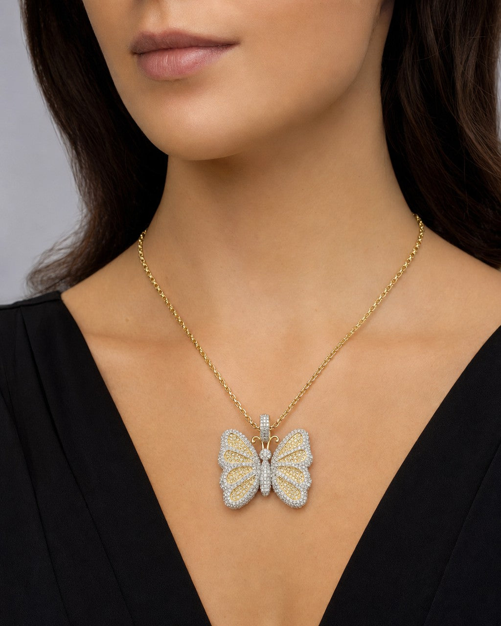 Female model wearing 14K Classic Butterfly Diamond Pendant