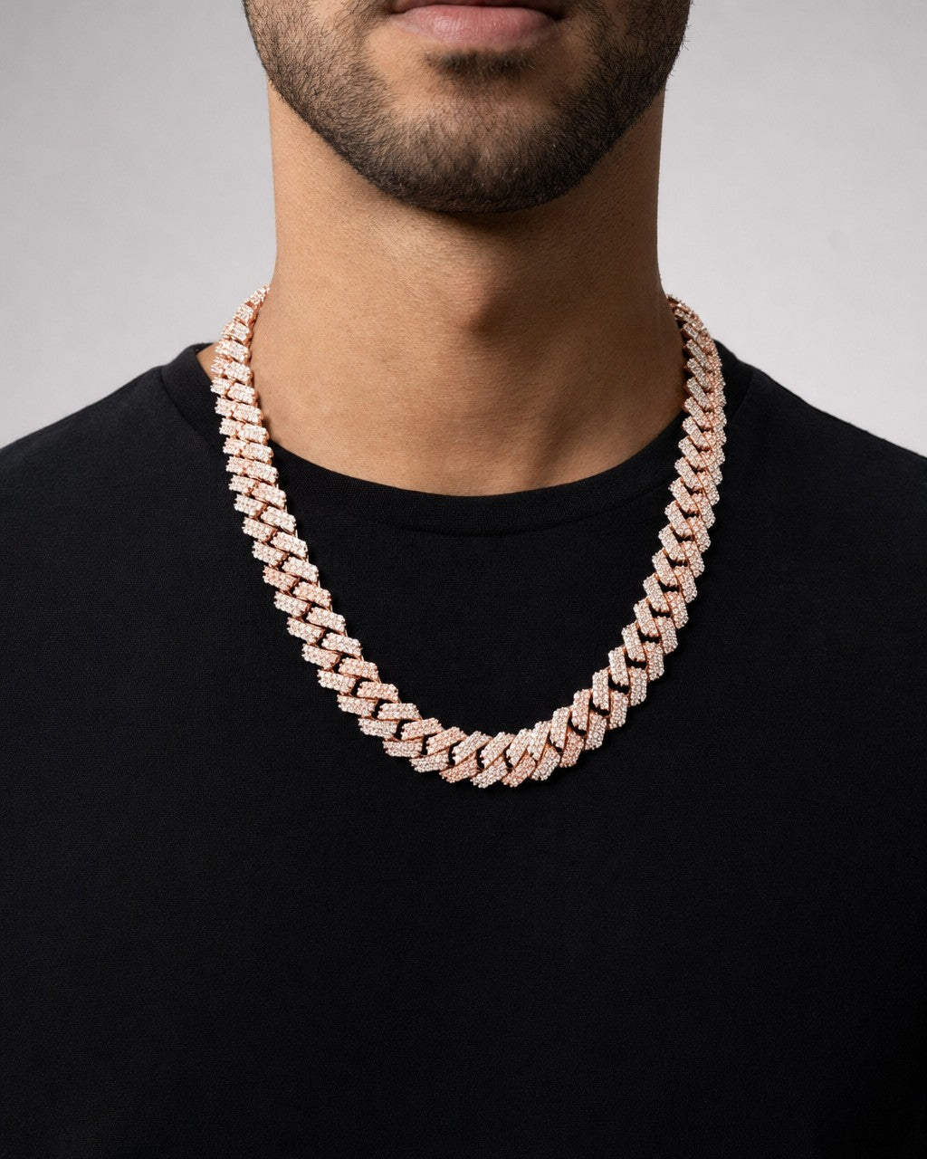 Male model wearing 10k 16Mm Two-Tone Rose and White Diamond Cuban Chain 22.5”