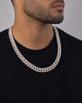 Male model wearing 10K 12.5mm White Gold Baguette Cuban Chain 22"