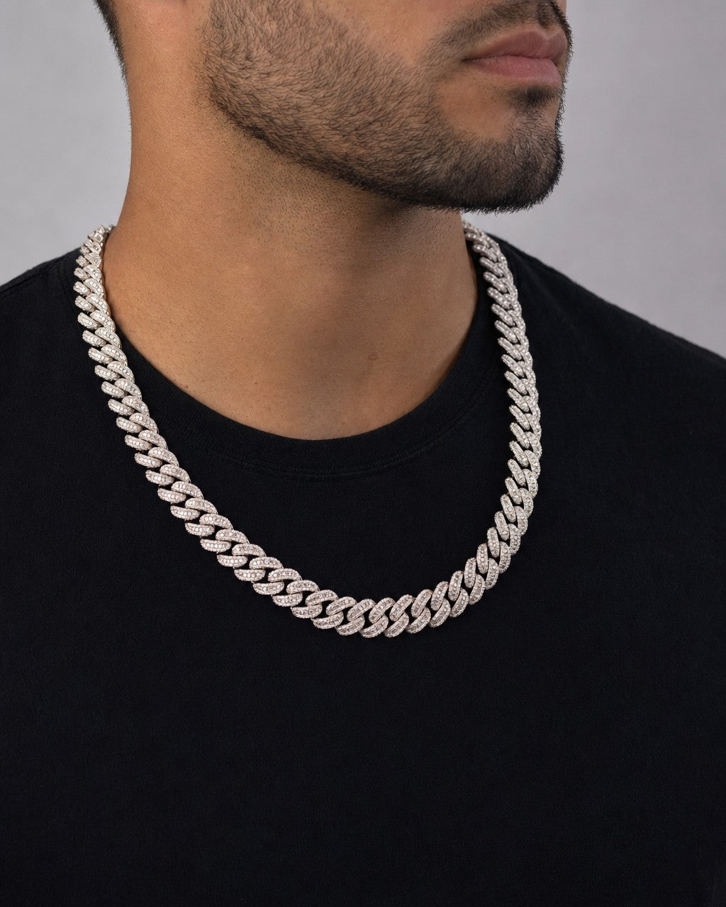 Male model wearing 10K 12.5mm White Gold Baguette Cuban Chain 22"